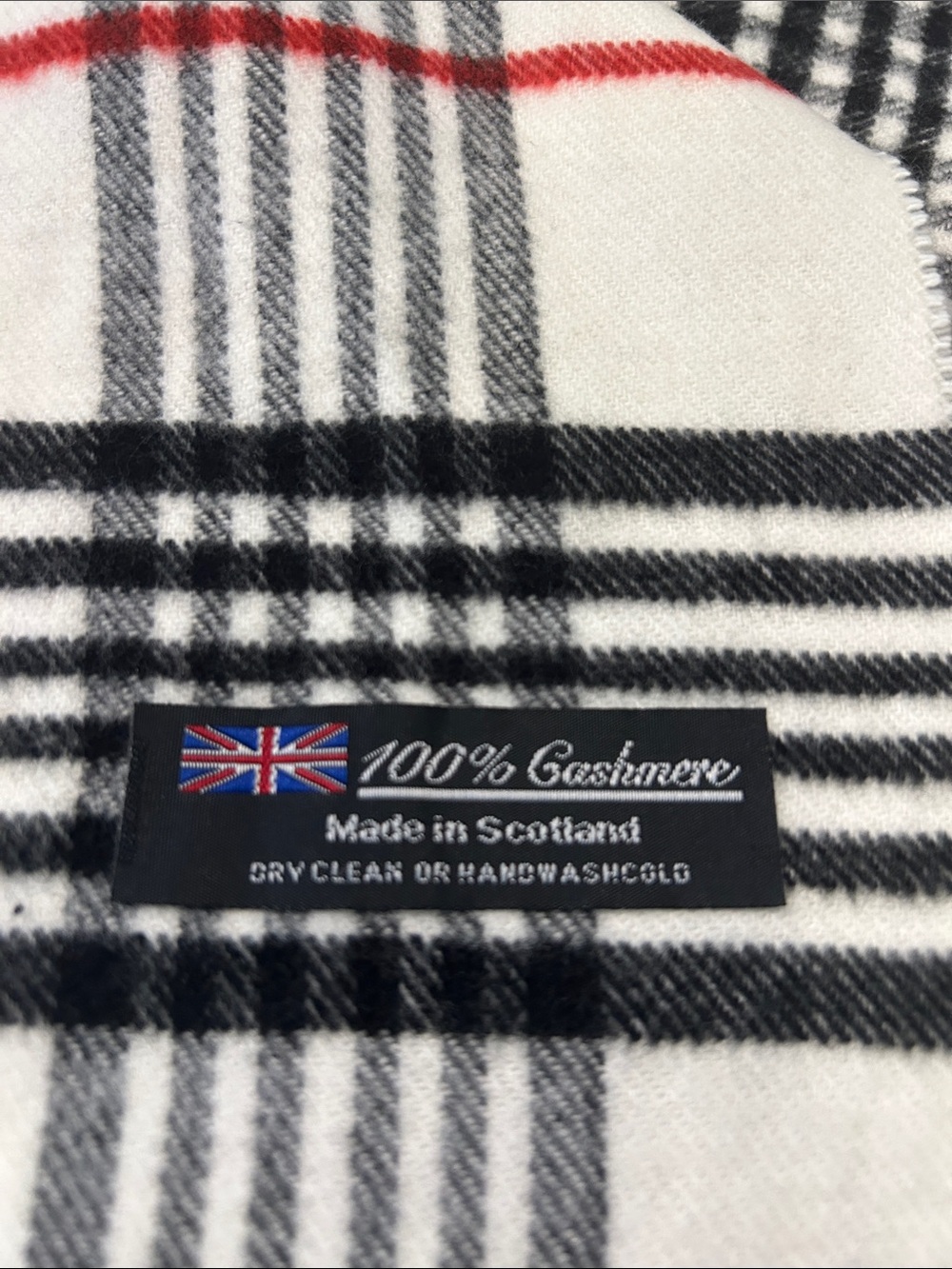 100% cashmere scarf, white check plaid with black and red accent lines